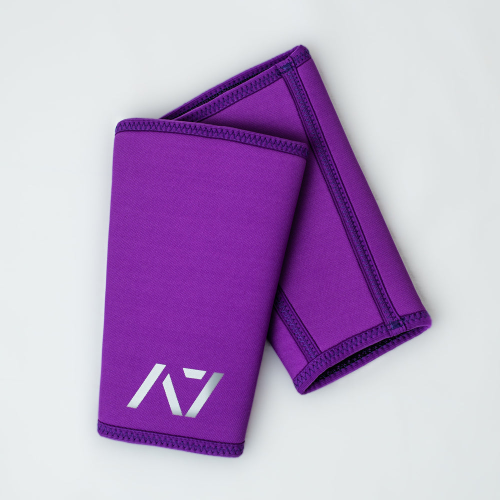 
                      
                        A7 IPF approved Purple CONE knee sleeves are structured with a downward cut panel on the back of the quad and calf to ensure ultimate compression at the knee joint. A7 CONE knee sleeves are IPF approved for use in all powerlifting competitions. A7 CONE Knee Sleeves are IPF Approved Kit. A7 cone knee sleeves are made with high quality neoprene and the knee sleeves are sold as a pair. The double seam on the knee sleeves create a greater tension on the knee joint. A7 UK shipping to UK and Europe. 
                      
                    